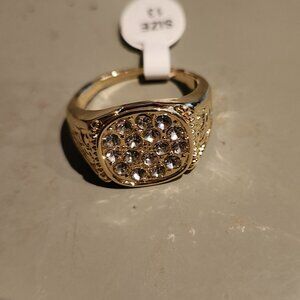 Gold nugget ring with zirconia stones.